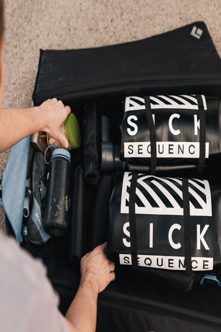 Two inflatable crash pads packed inside a climbing bag - travel-ready and compact.